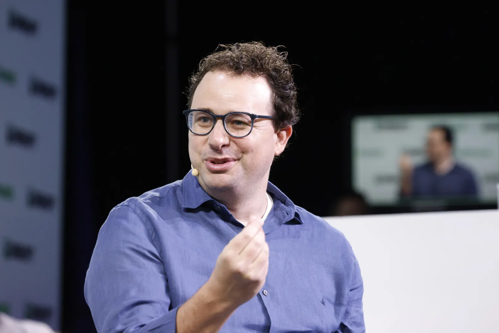 Dario Amodei, CEO of Anthropic, speaking on stage at TechCrunch Disrupt 2023.